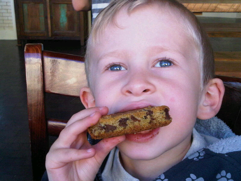 Client/child eating a cookie and doing feeding therapy