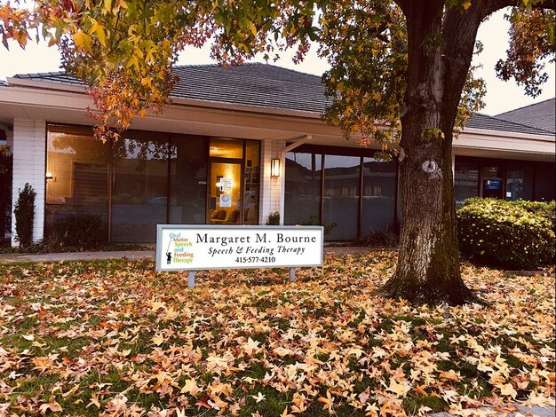 The exterior of Margaret's office space in the fall with leaves on the ground.