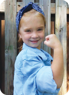 Client/child posing as Rosie the Riveter
